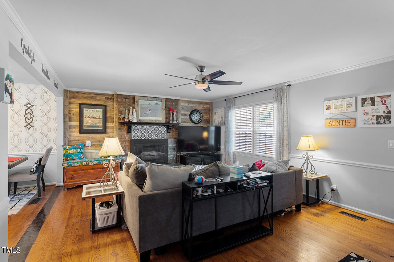 1660 Benson Road Angier, NC 27501 - Photo 7 of 32 a living room with furniture and a flat screen tv