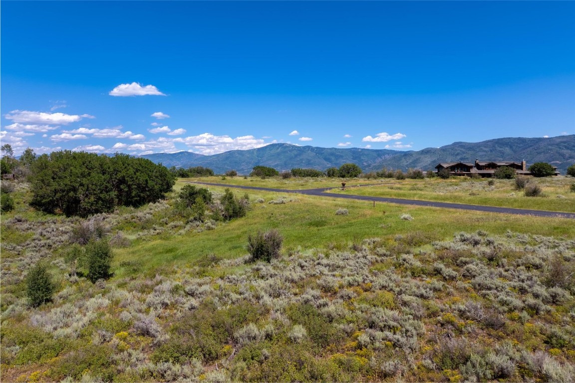 30575 Marshall Ridge Steamboat Springs, CO 80487 - Photo 14 of 18 a view of a lake with sunset and trees