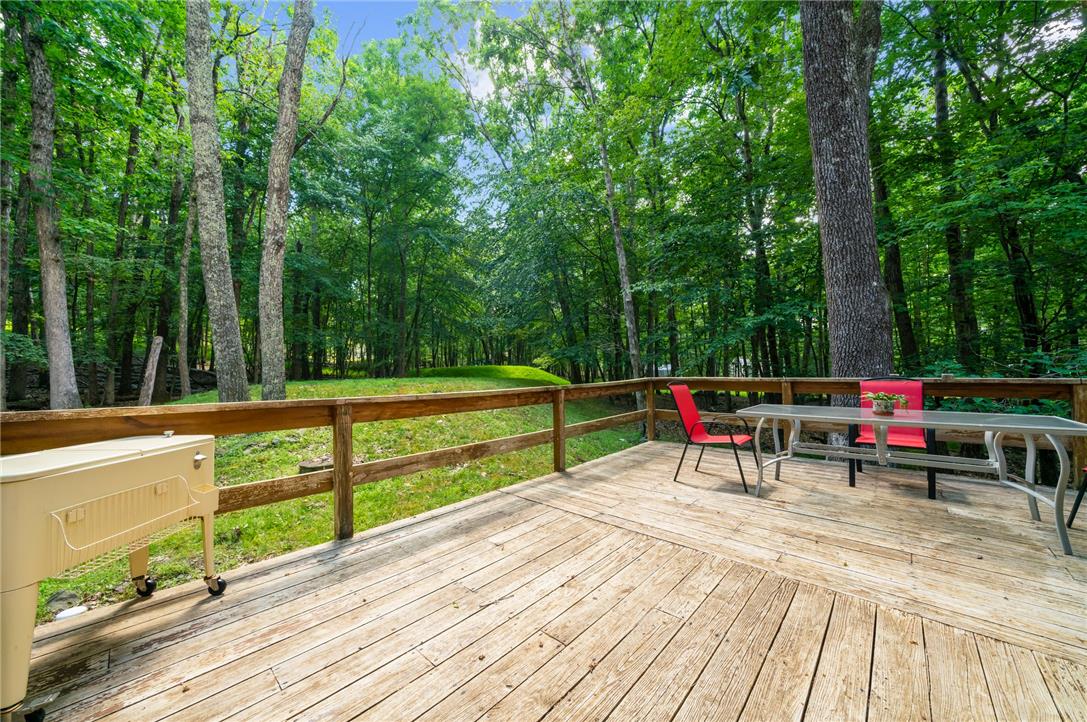 222 Powder Horn Road Henryville, PA 18332 - Photo 22 of 25 Relax on this expansive outdoor deck, surrounded by verdant trees and natural tranquility.