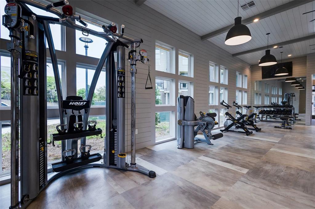 4020 McEwen Road, Unit 4106 Farmers Branch, TX 75244 - Photo 20 of 26 Gym with wood walls, recessed lighting, a wooden ceiling with exposed beams, and a high ceiling