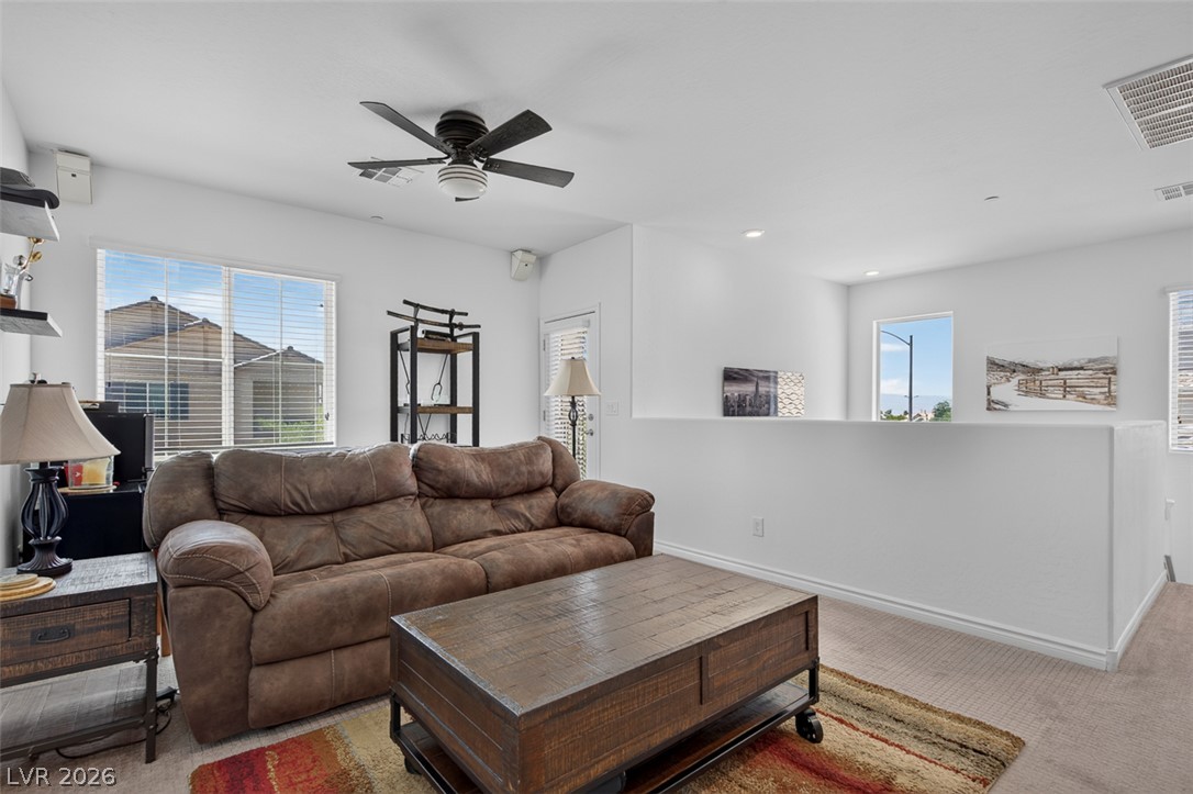 1824 Redland Ridge Street Henderson, NV 89002 - Photo 31 of 69 A comfortable living space featuring large windows and an open-concept layout.