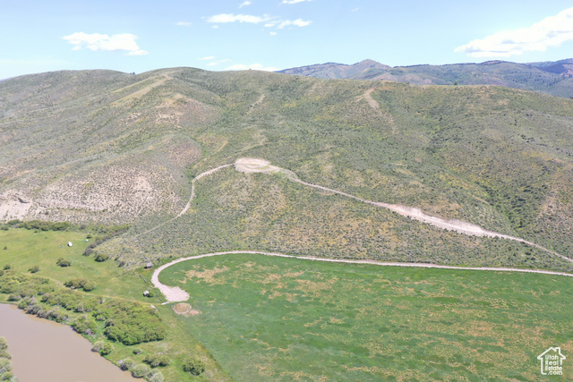 Undisclosed Address Georgetown, ID 83239 - Photo 2 of 11 Aerial view of property and surrounding area with a mountain backdrop