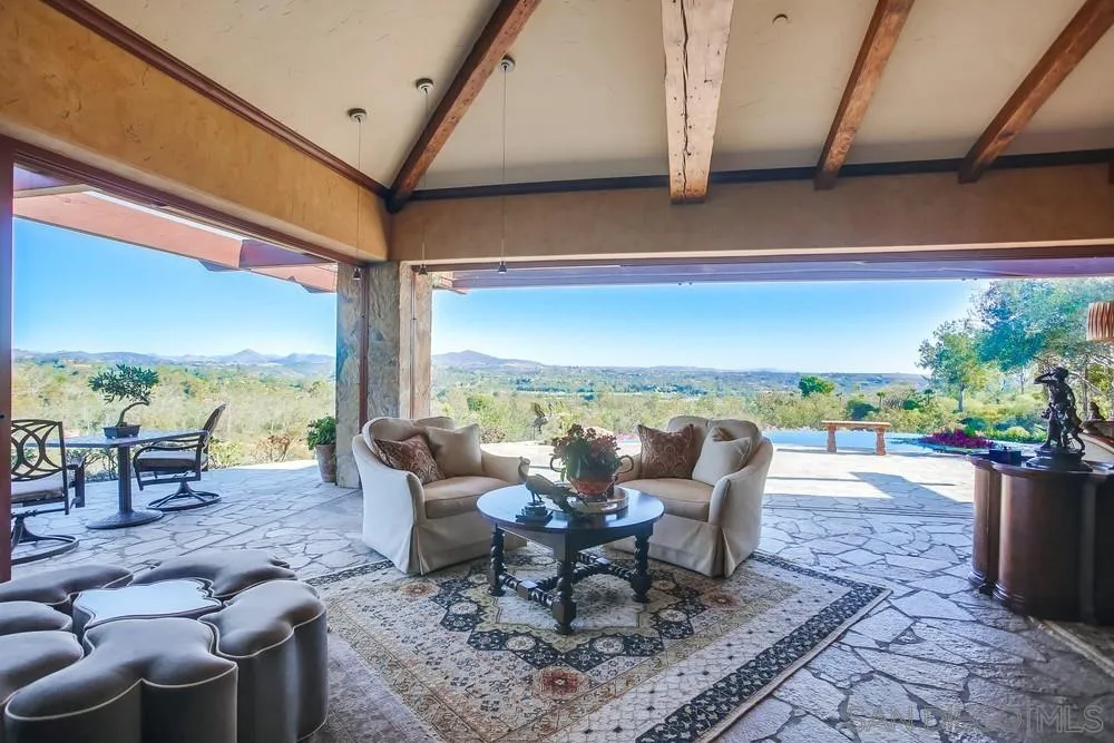 5653 Linea Del Cielo Rancho Santa Fe, CA 92067 - Photo 1 of 46 a view of a patio with a dining table and chairs