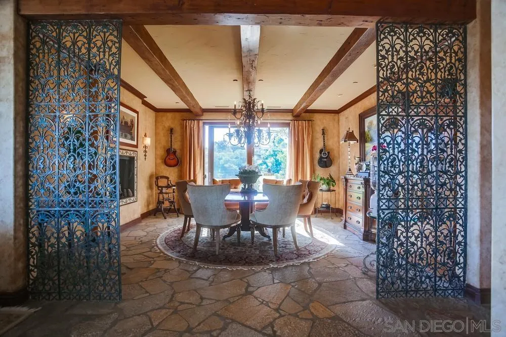 5653 Linea Del Cielo Rancho Santa Fe, CA 92067 - Photo 12 of 46 a dining room with furniture a chandelier and window