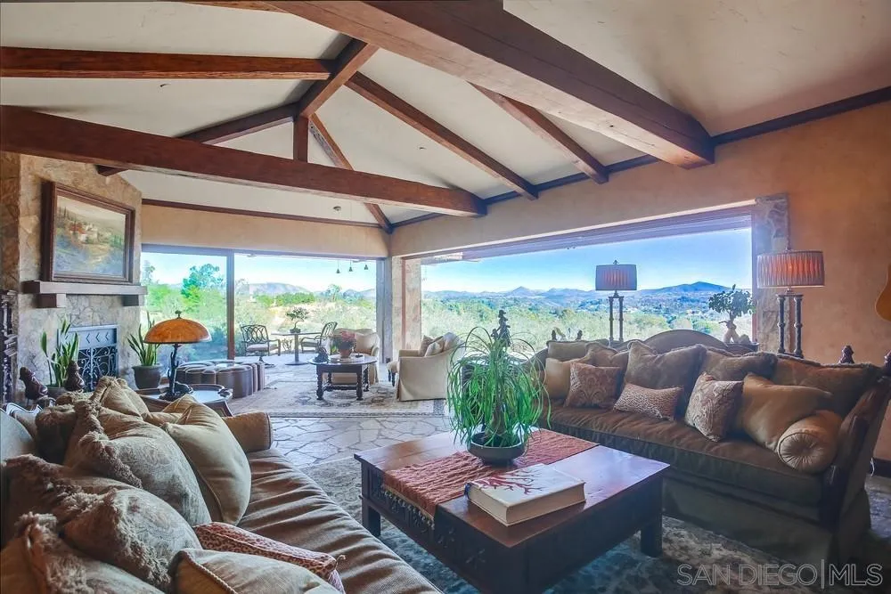 5653 Linea Del Cielo Rancho Santa Fe, CA 92067 - Photo 17 of 46 a living room with furniture and a large window