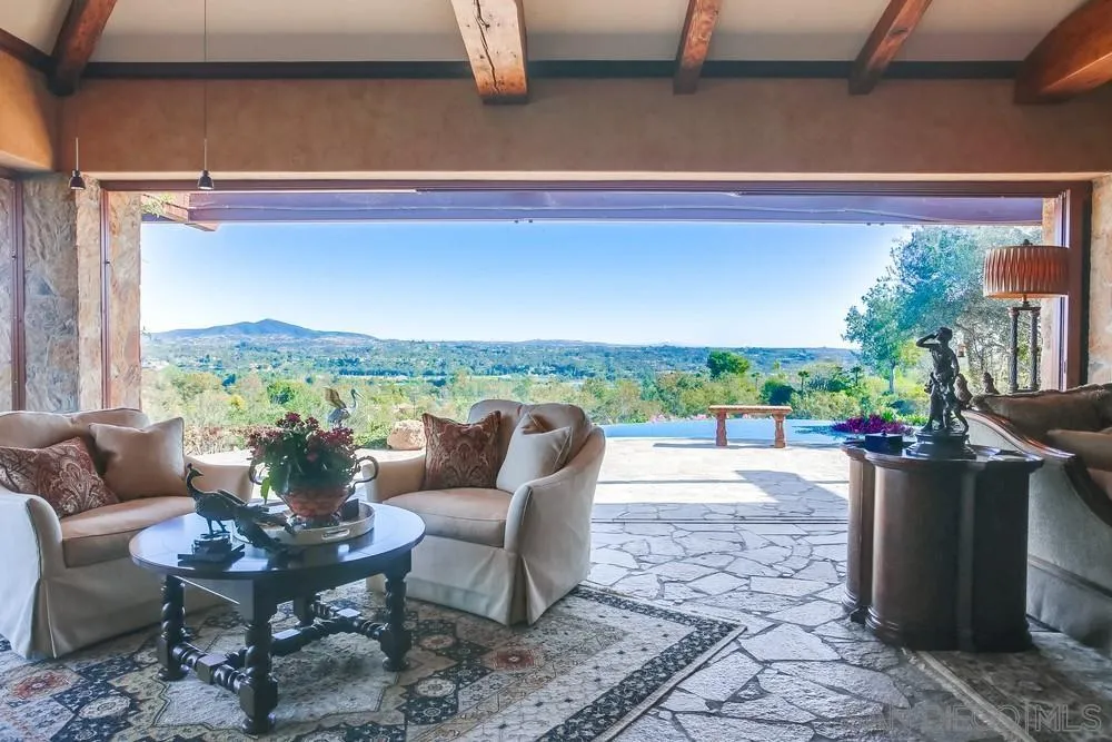 5653 Linea Del Cielo Rancho Santa Fe, CA 92067 - Photo 18 of 46 a view of a chairs and table in the patio
