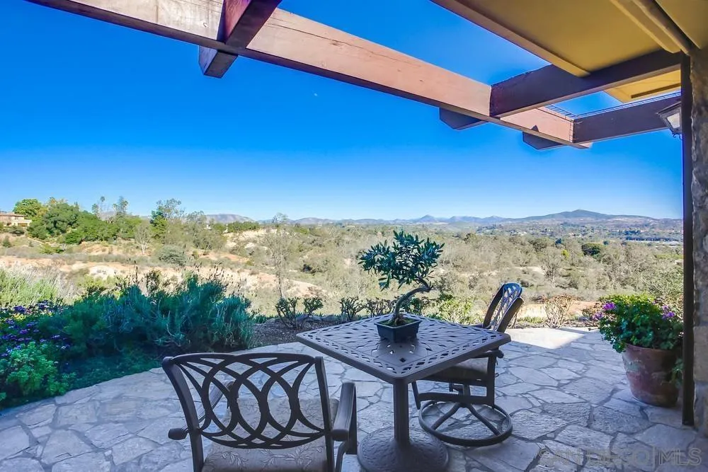 5653 Linea Del Cielo Rancho Santa Fe, CA 92067 - Photo 20 of 46 a view of a terrace with furniture and a potted plant