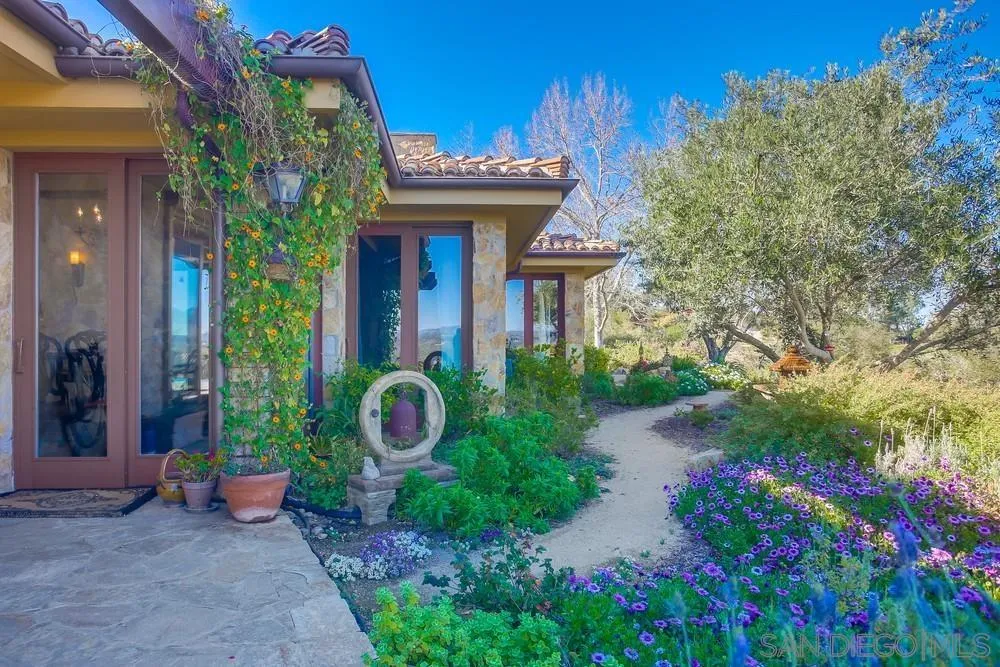 5653 Linea Del Cielo Rancho Santa Fe, CA 92067 - Photo 21 of 46 a view of a house with potted plants