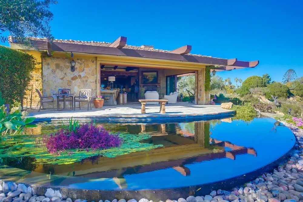 5653 Linea Del Cielo Rancho Santa Fe, CA 92067 - Photo 23 of 46 a view of a house with swimming pool and sitting area