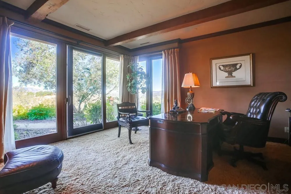 5653 Linea Del Cielo Rancho Santa Fe, CA 92067 - Photo 26 of 46 a living room with furniture and a floor to ceiling window