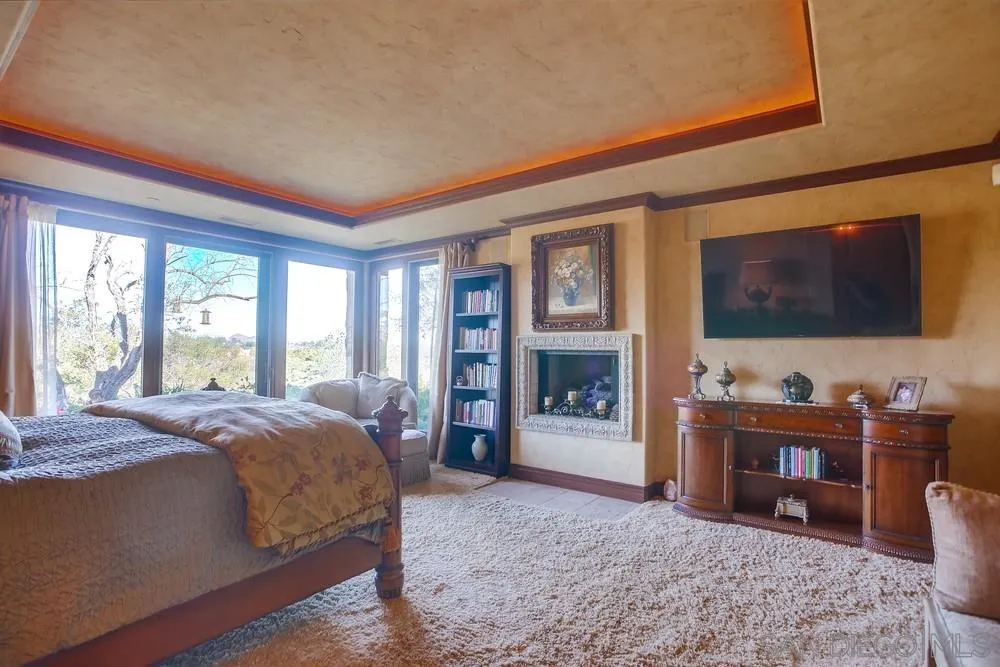 5653 Linea Del Cielo Rancho Santa Fe, CA 92067 - Photo 28 of 46 a bedroom with a bed and a television