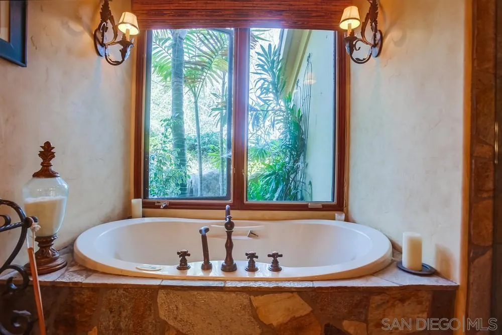 5653 Linea Del Cielo Rancho Santa Fe, CA 92067 - Photo 31 of 46 a view of bath tub sitting in a bathroom next to a window