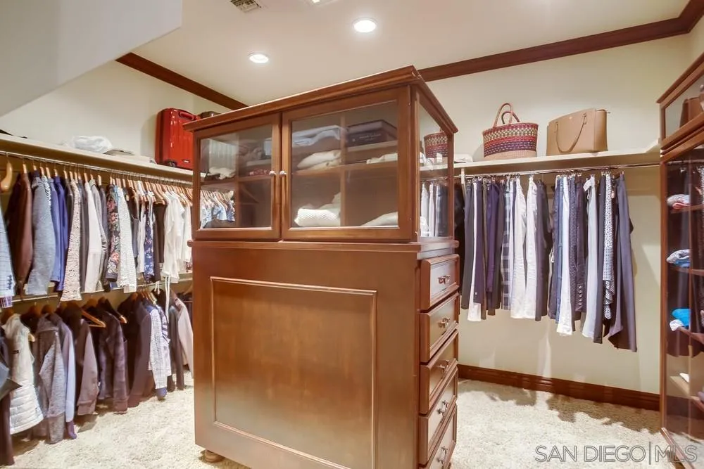 5653 Linea Del Cielo Rancho Santa Fe, CA 92067 - Photo 32 of 46 a view of walk in closet with clothes and shoes