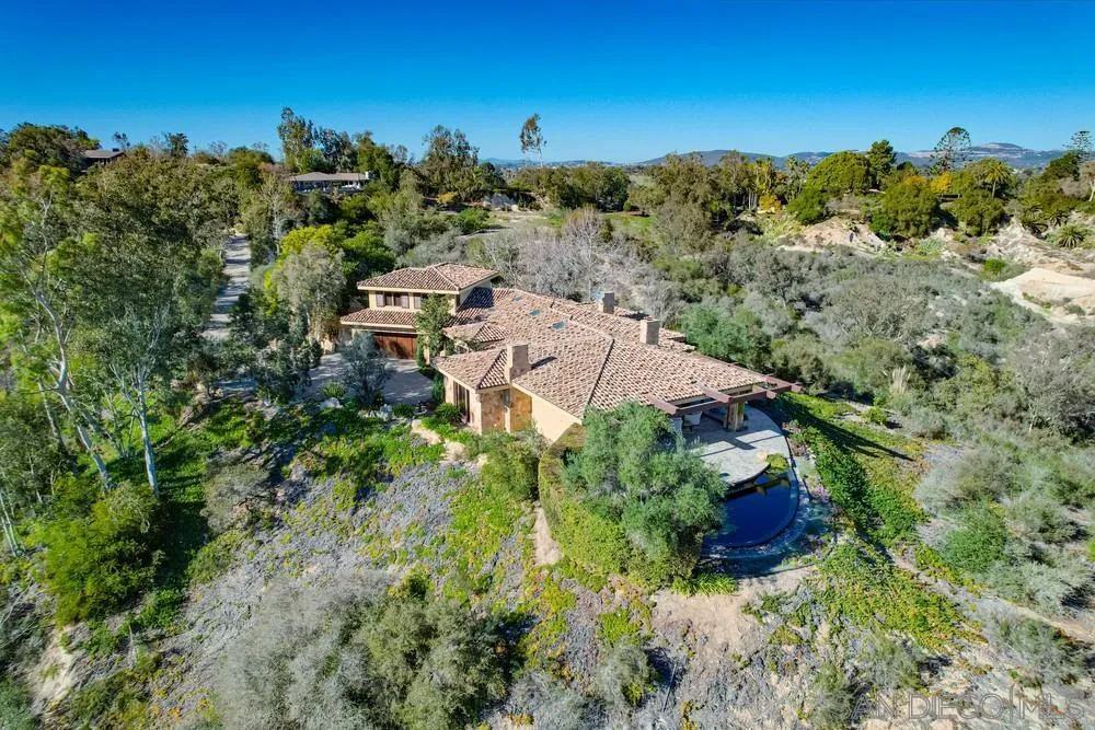5653 Linea Del Cielo Rancho Santa Fe, CA 92067 - Photo 42 of 46 a aerial view of a house with a yard