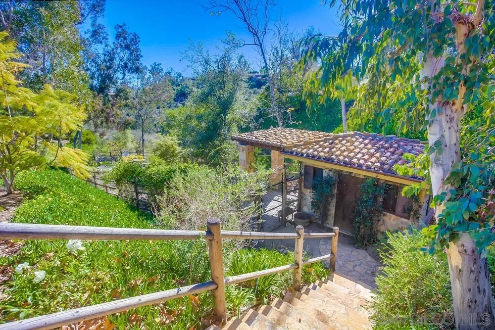 5653 Linea Del Cielo Rancho Santa Fe, CA 92067 - Photo 6 of 46 a view of a wooden fence with a bench