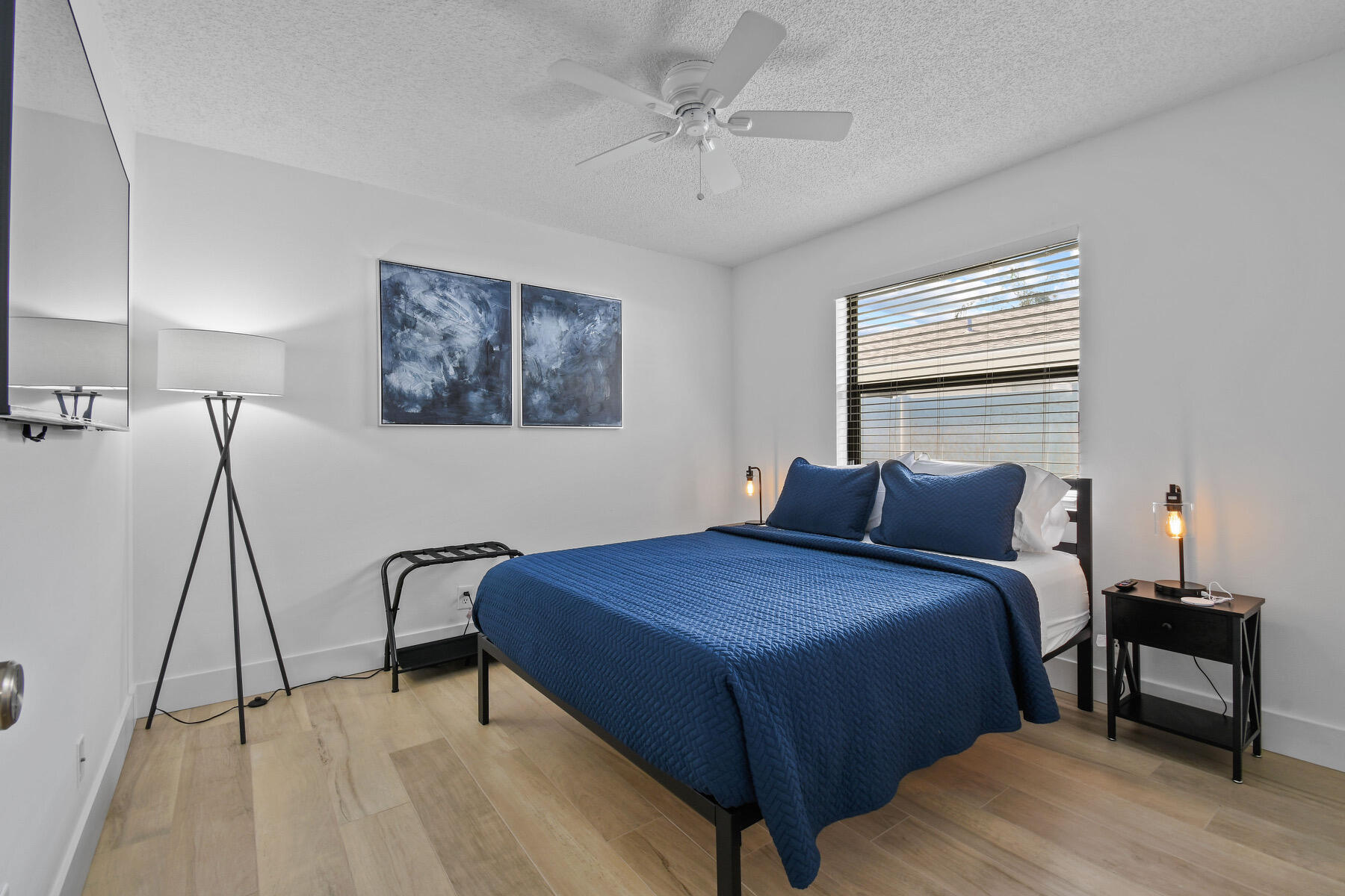 4153 Wingo Street Jupiter, FL 33469 - Photo 22 of 39 a bedroom with a bed and a table