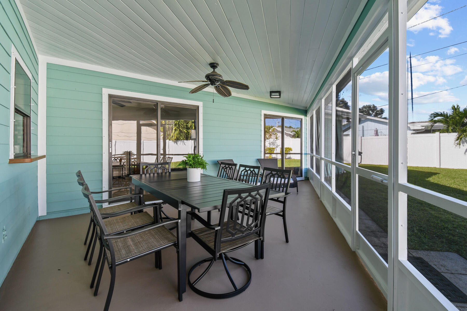 4153 Wingo Street Jupiter, FL 33469 - Photo 34 of 39 a view of a dining room with furniture window and wooden floor