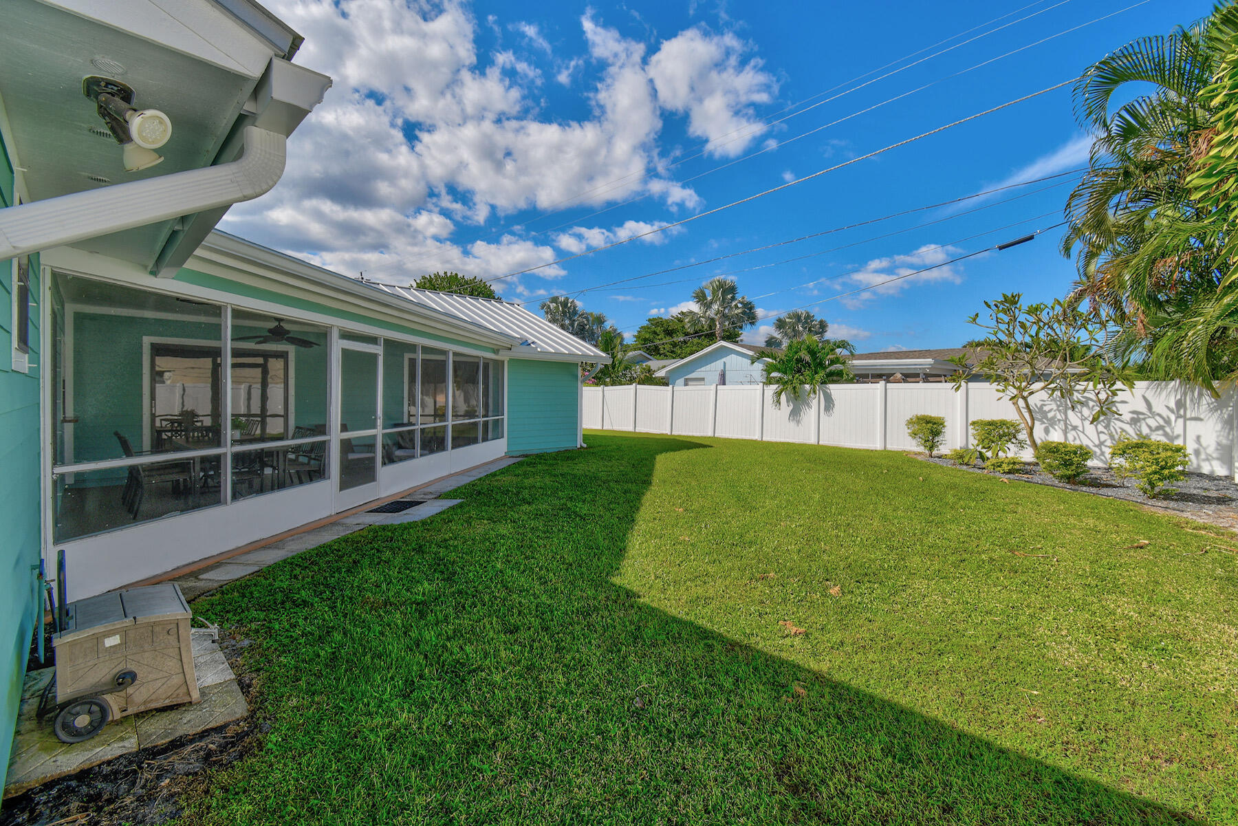 4153 Wingo Street Jupiter, FL 33469 - Photo 35 of 39 a view of house with backyard