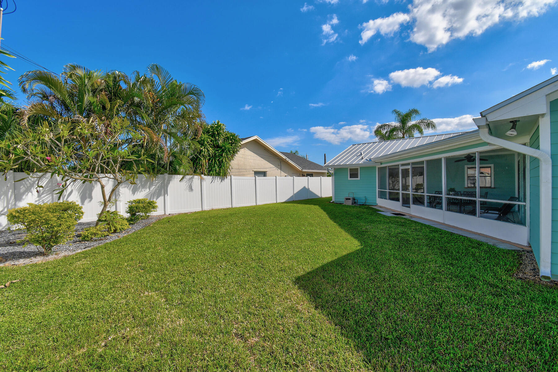 4153 Wingo Street Jupiter, FL 33469 - Photo 36 of 39 a view of house with backyard and garden