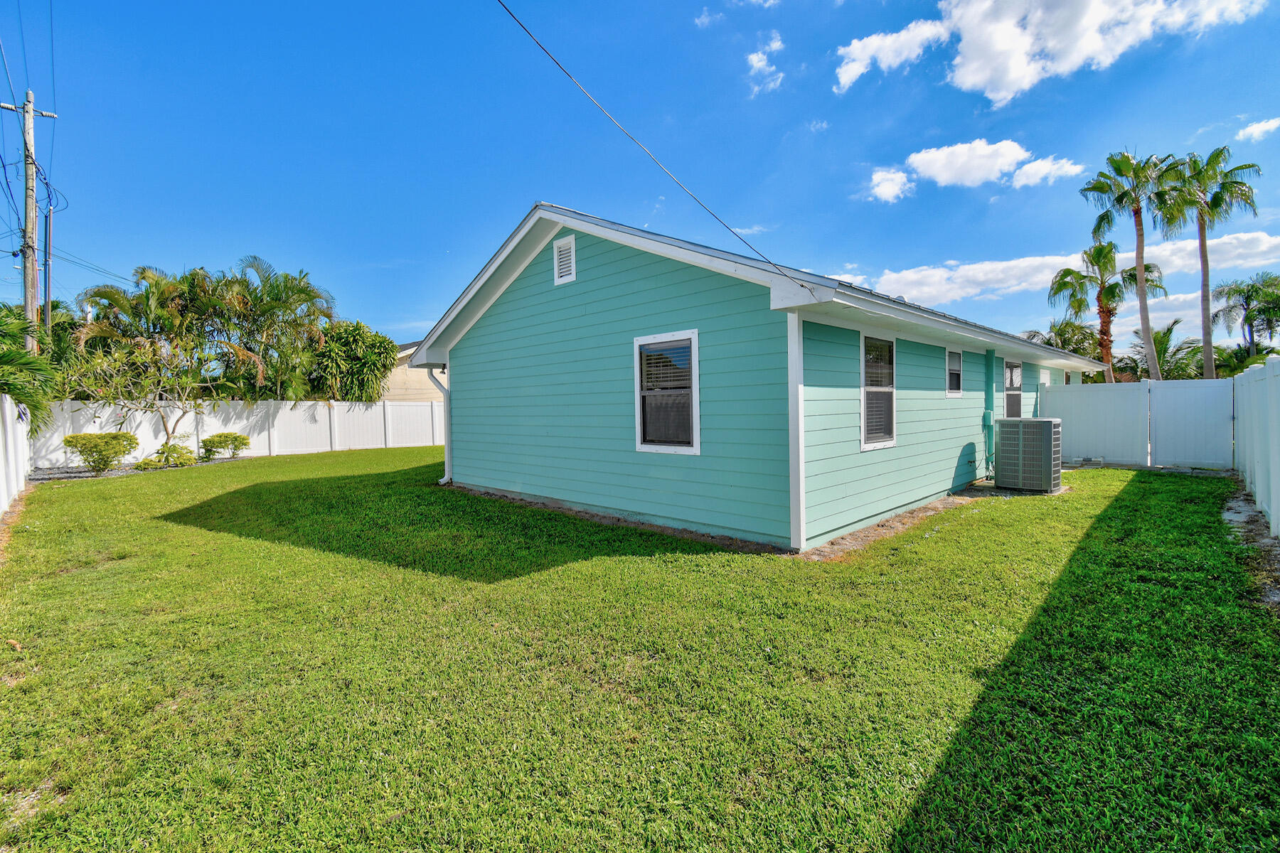 4153 Wingo Street Jupiter, FL 33469 - Photo 37 of 39 a view of a house with backyard and garden