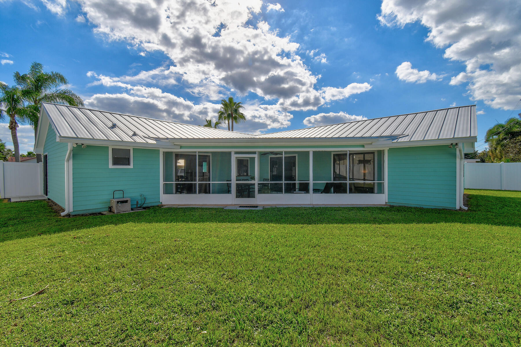 4153 Wingo Street Jupiter, FL 33469 - Photo 38 of 39 a view of a house with a backyard