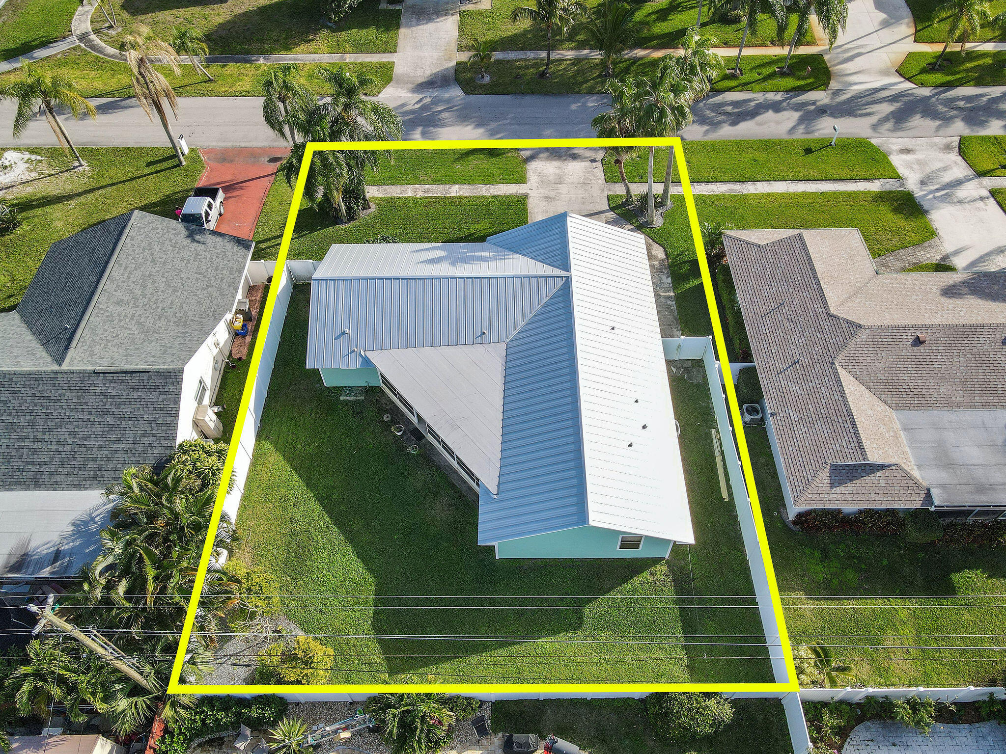4153 Wingo Street Jupiter, FL 33469 - Photo 39 of 39 an aerial view of a house with a swimming pool