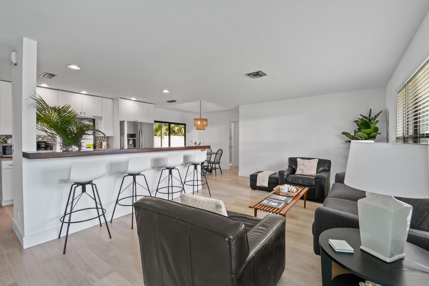 4153 Wingo Street Jupiter, FL 33469 - Photo 5 of 39 a living room with furniture and a table