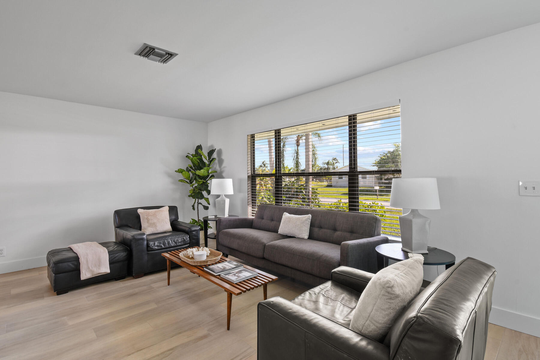 4153 Wingo Street Jupiter, FL 33469 - Photo 7 of 39 a living room with furniture and a window