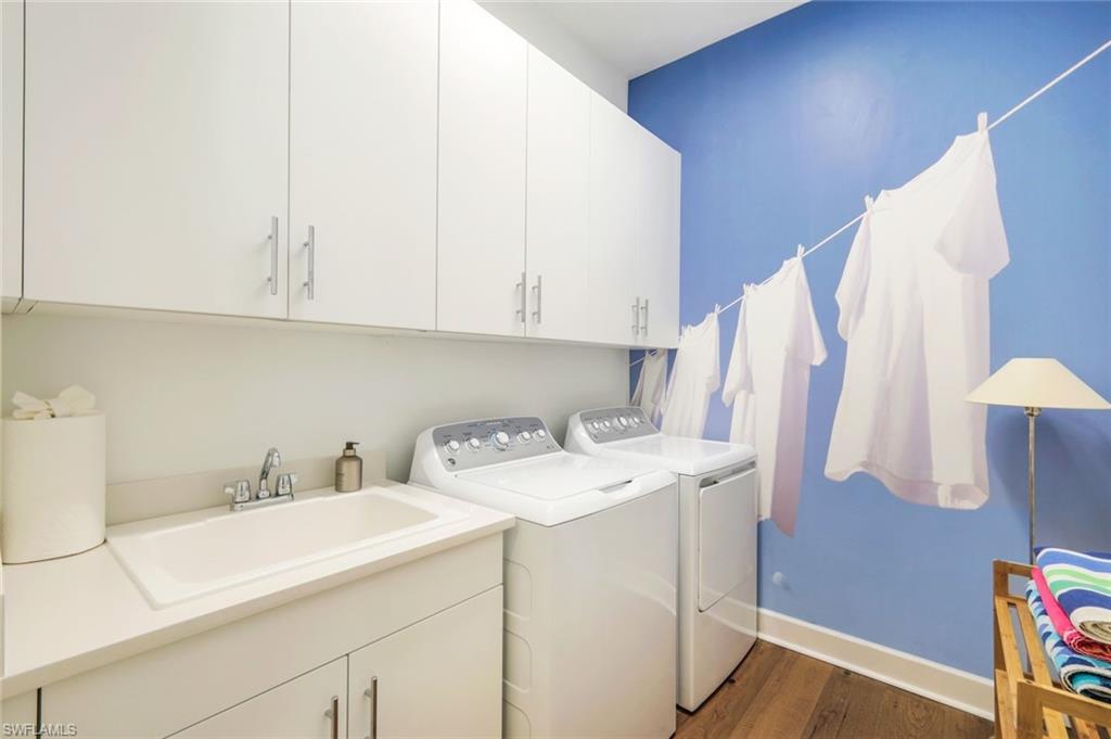 11322 Jacaranda Drive Naples, FL 34120 - Photo 11 of 42 a utility room with dryer and washer