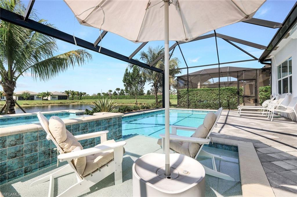 11322 Jacaranda Drive Naples, FL 34120 - Photo 40 of 42 a view of outdoor space yard swimming pool and patio
