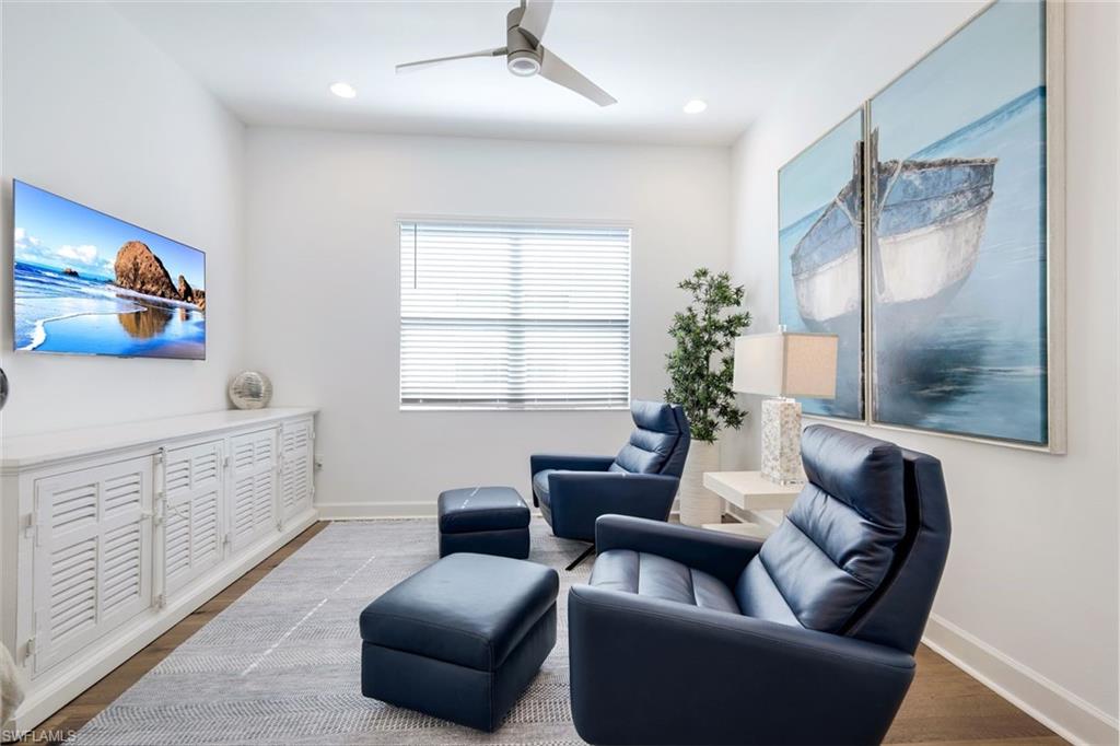 11322 Jacaranda Drive Naples, FL 34120 - Photo 9 of 42 a living room with furniture and a window