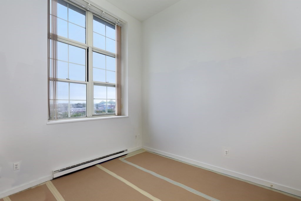 30 Monument Square, Unit 404 Boston, MA 02129 - Photo 8 of 14 a view of an empty room with a window