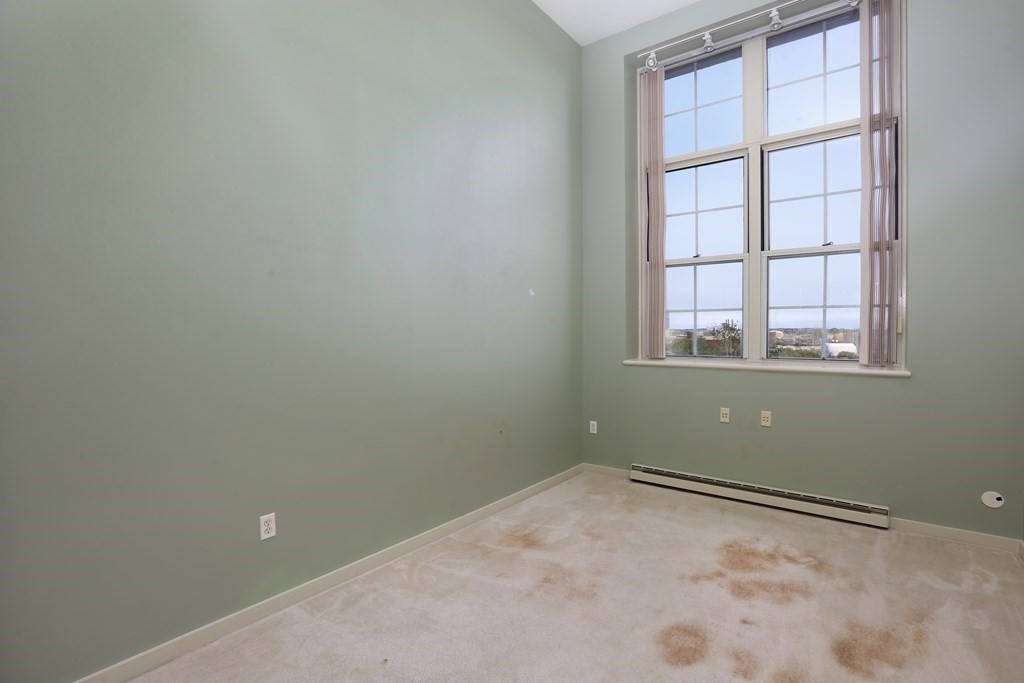 30 Monument Square, Unit 404 Boston, MA 02129 - Photo 9 of 14 an empty room with a window
