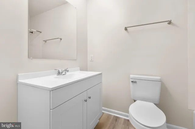 a bathroom with a bathtub shower and toilet