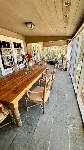 a view of a livingroom with furniture and a window