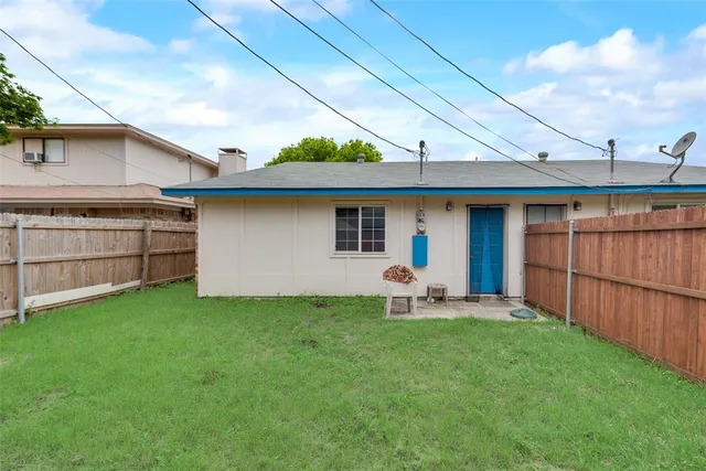 a view of a backyard with potted plants