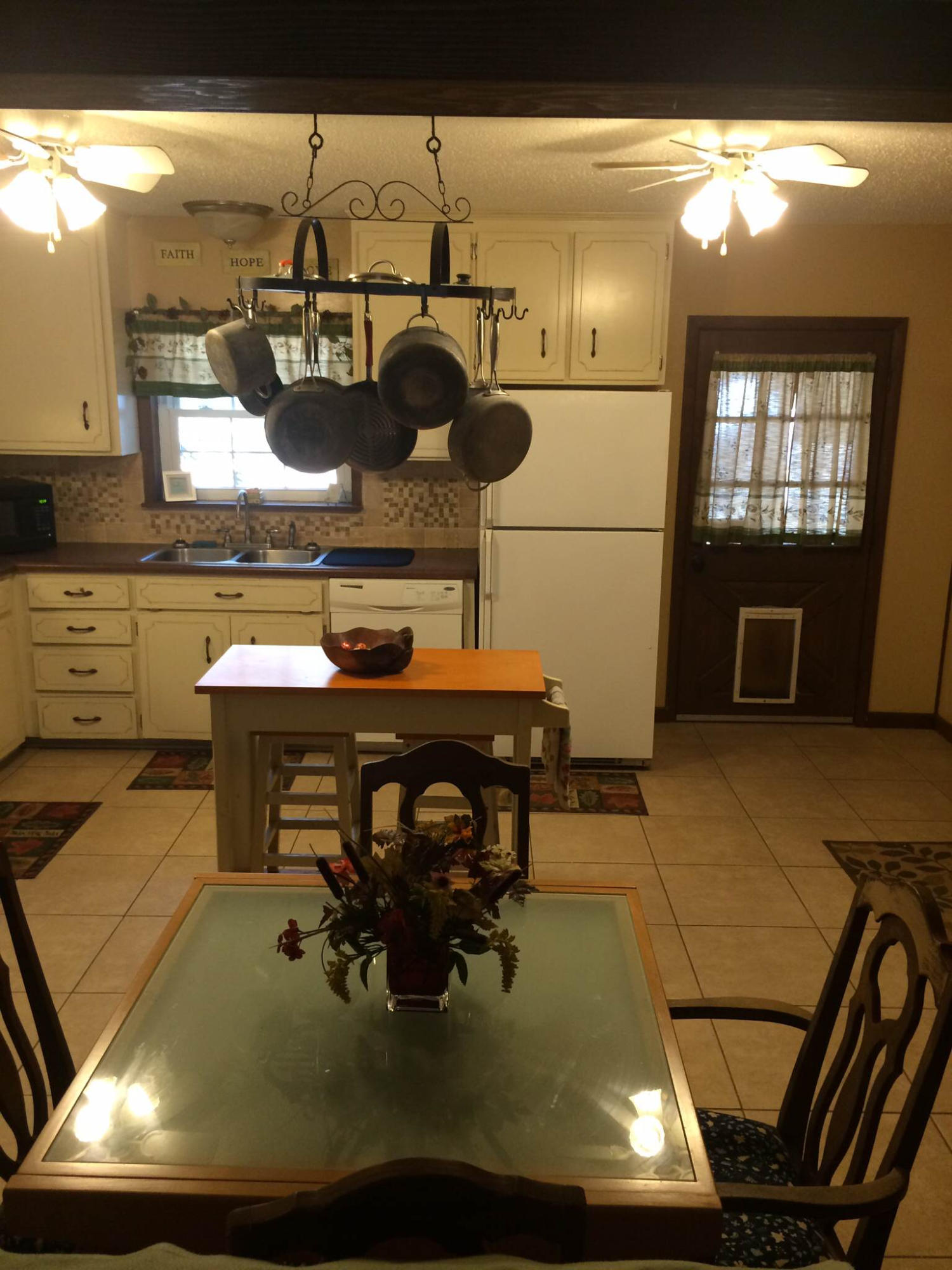 5555 Buck Ward Road Baker, FL 32531 - Photo 14 of 68 a kitchen with a stove and a refrigerator