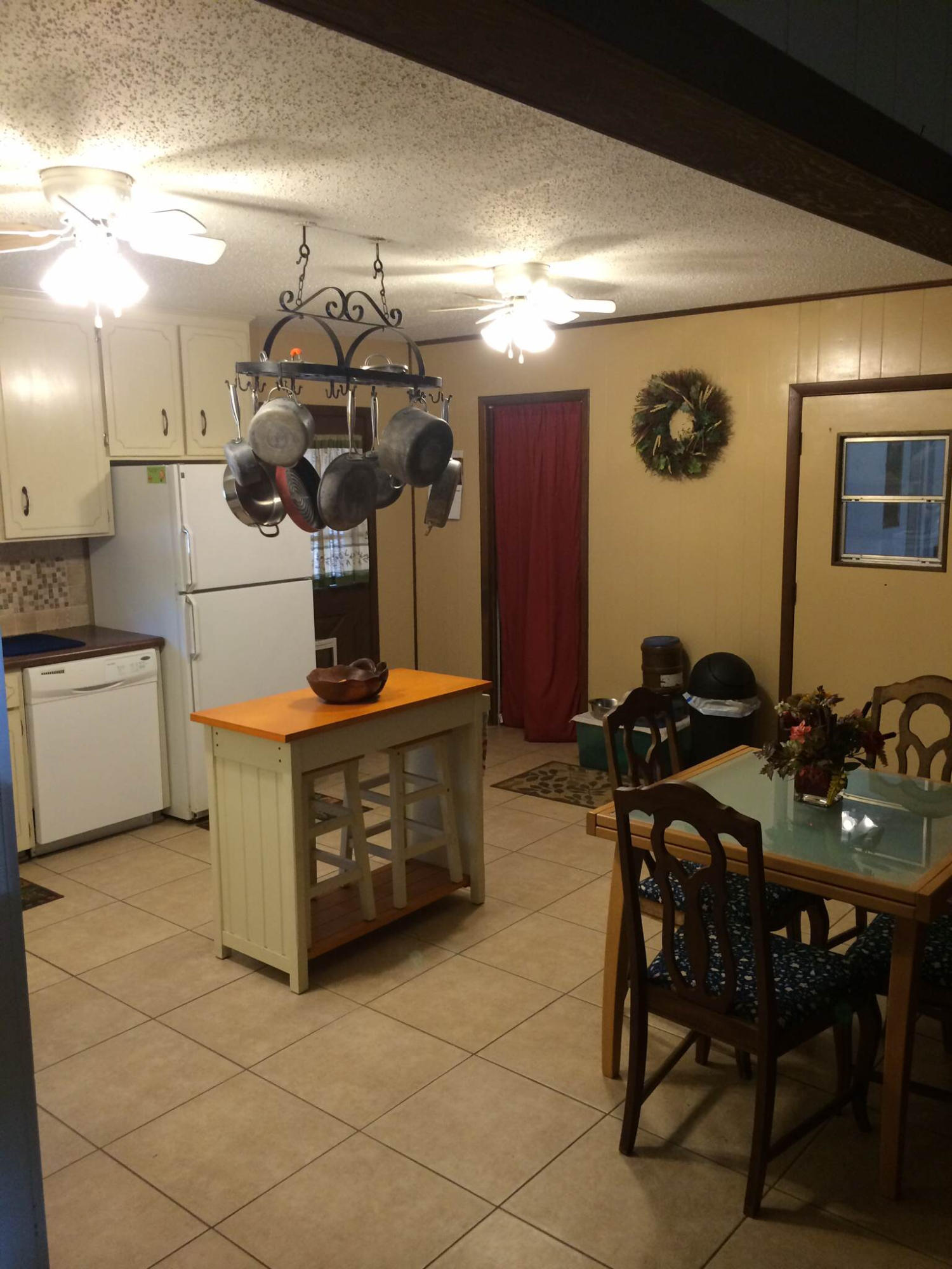 5555 Buck Ward Road Baker, FL 32531 - Photo 17 of 68 a kitchen with a table and chairs in it
