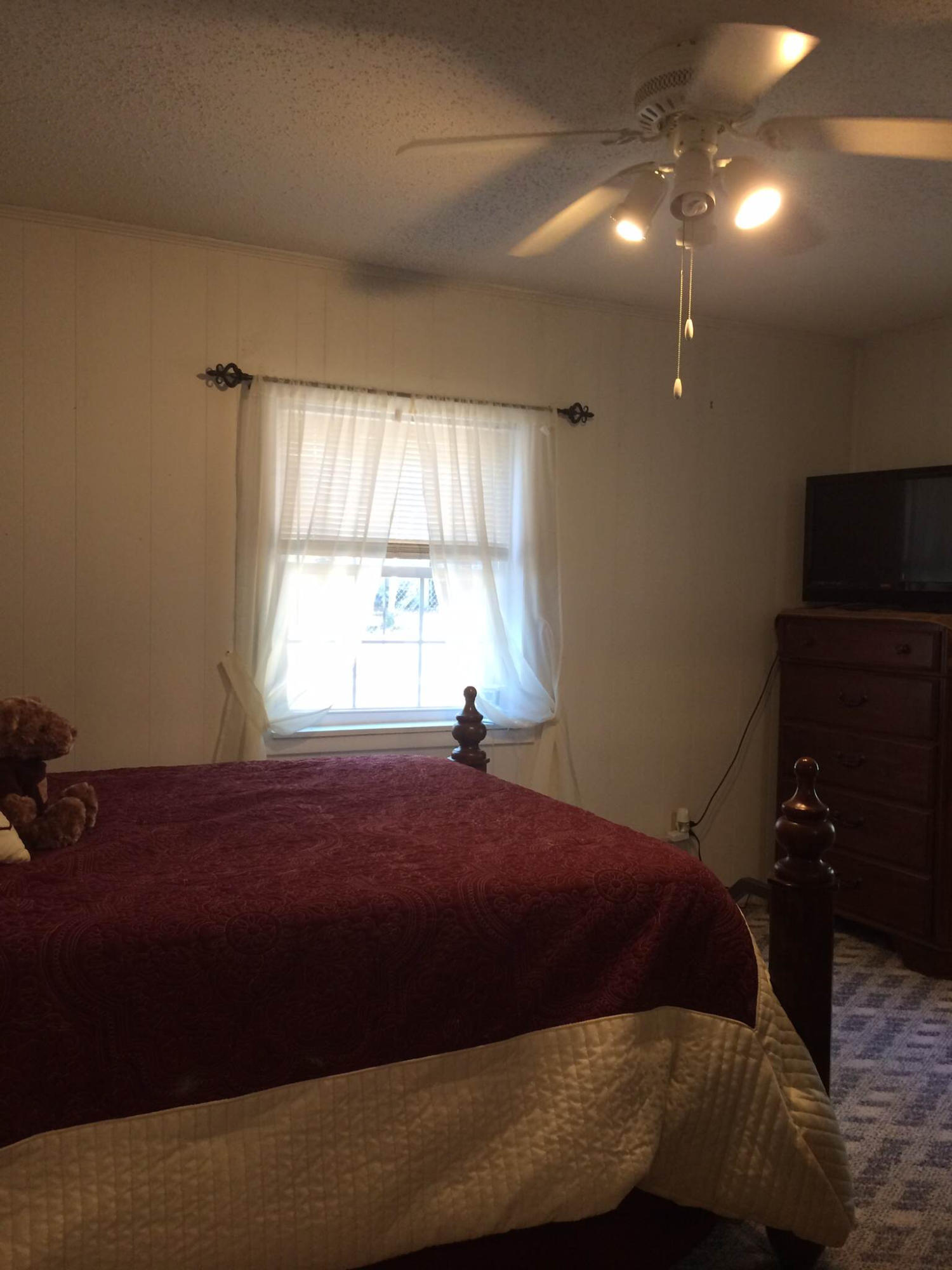 5555 Buck Ward Road Baker, FL 32531 - Photo 29 of 68 a bedroom with a bed and a window