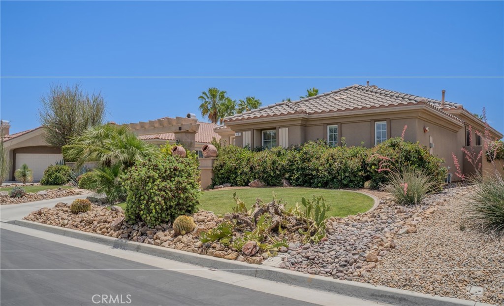 41 Vista Mirage Way Rancho Mirage, CA 92270 - Photo 1 of 25 a front view of a house with a yard