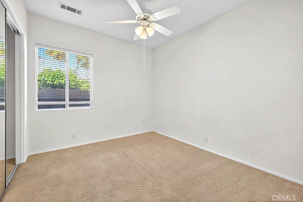 41 Vista Mirage Way Rancho Mirage, CA 92270 - Photo 11 of 25 an empty room with a window and a fan