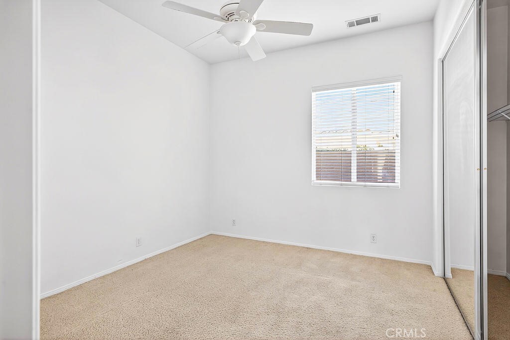 41 Vista Mirage Way Rancho Mirage, CA 92270 - Photo 12 of 25 an empty room with a window and a fan