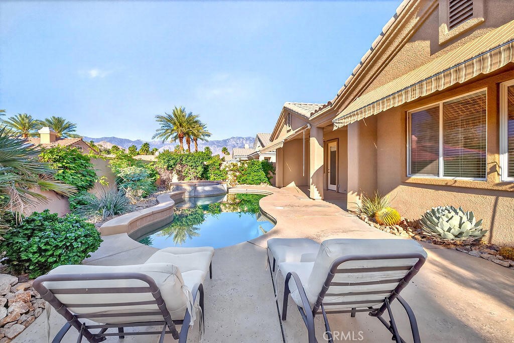 41 Vista Mirage Way Rancho Mirage, CA 92270 - Photo 23 of 25 a view of a patio with table and chairs and potted plants
