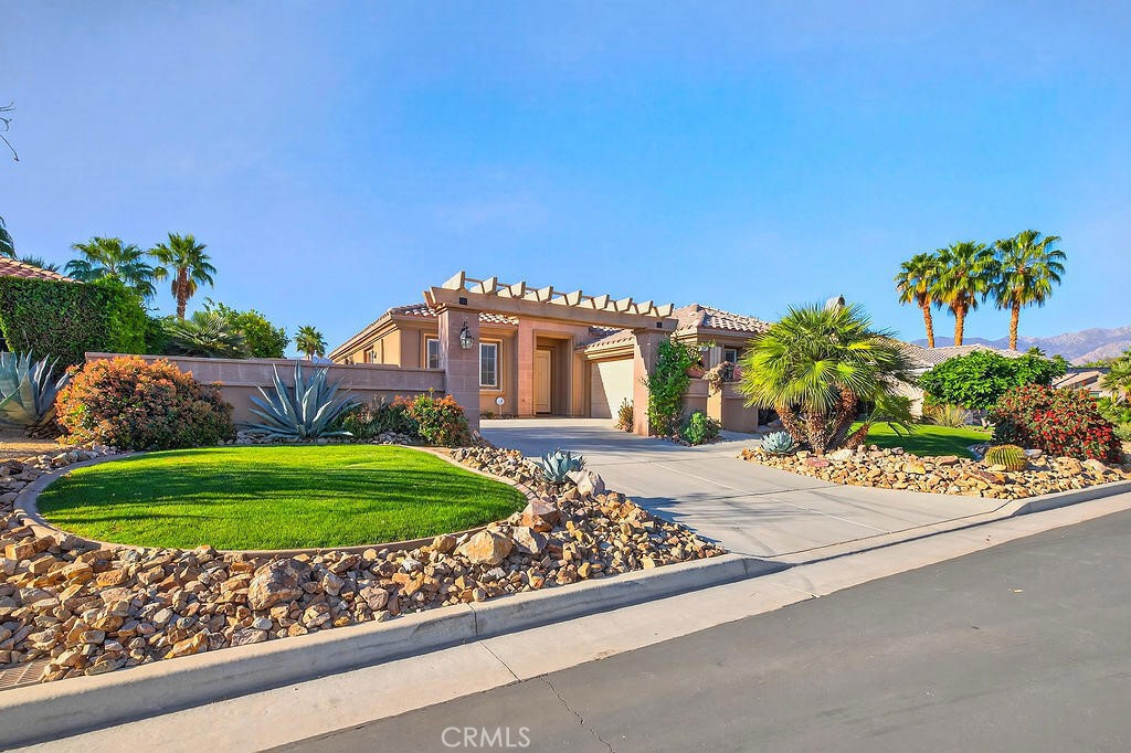 41 Vista Mirage Way Rancho Mirage, CA 92270 - Photo 4 of 25 a front view of a house with a yard
