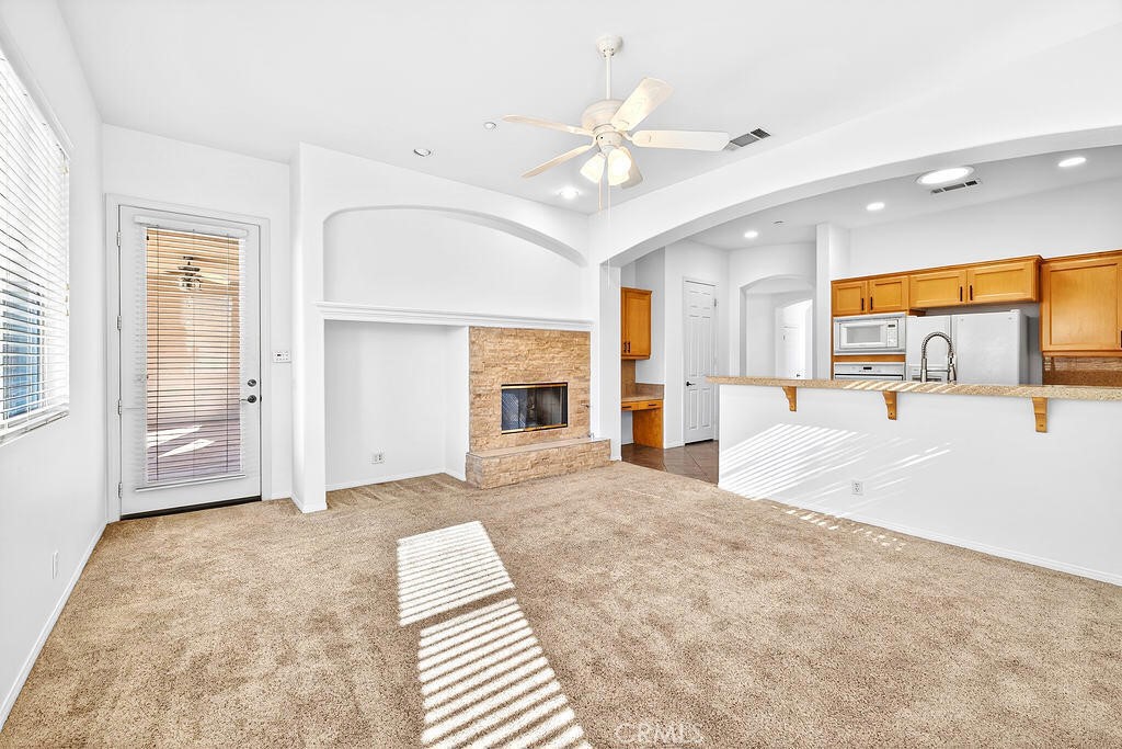 41 Vista Mirage Way Rancho Mirage, CA 92270 - Photo 10 of 25 a large white bedroom with a large bed and chandelier