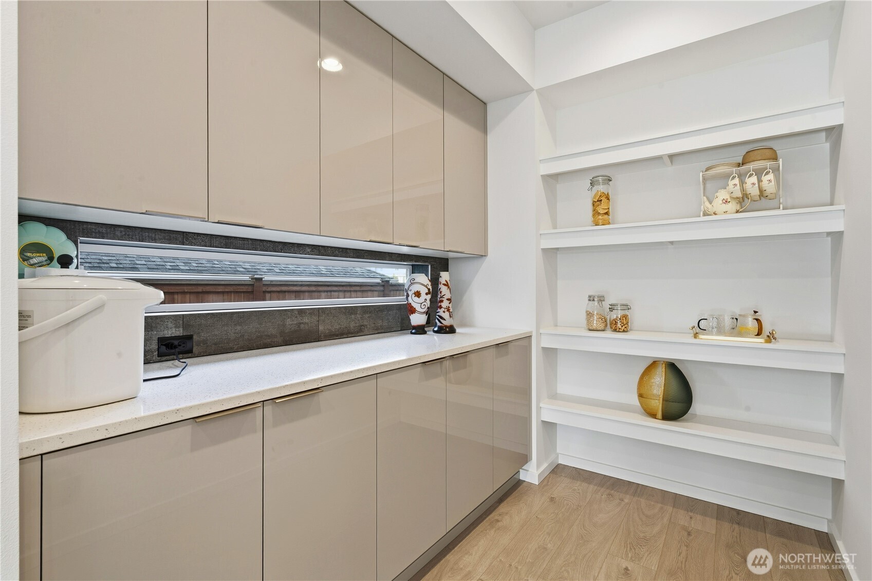 6563 Southeast 8th Street Renton, WA 98059 - Photo 15 of 40 a washing machine sitting inside of a kitchen