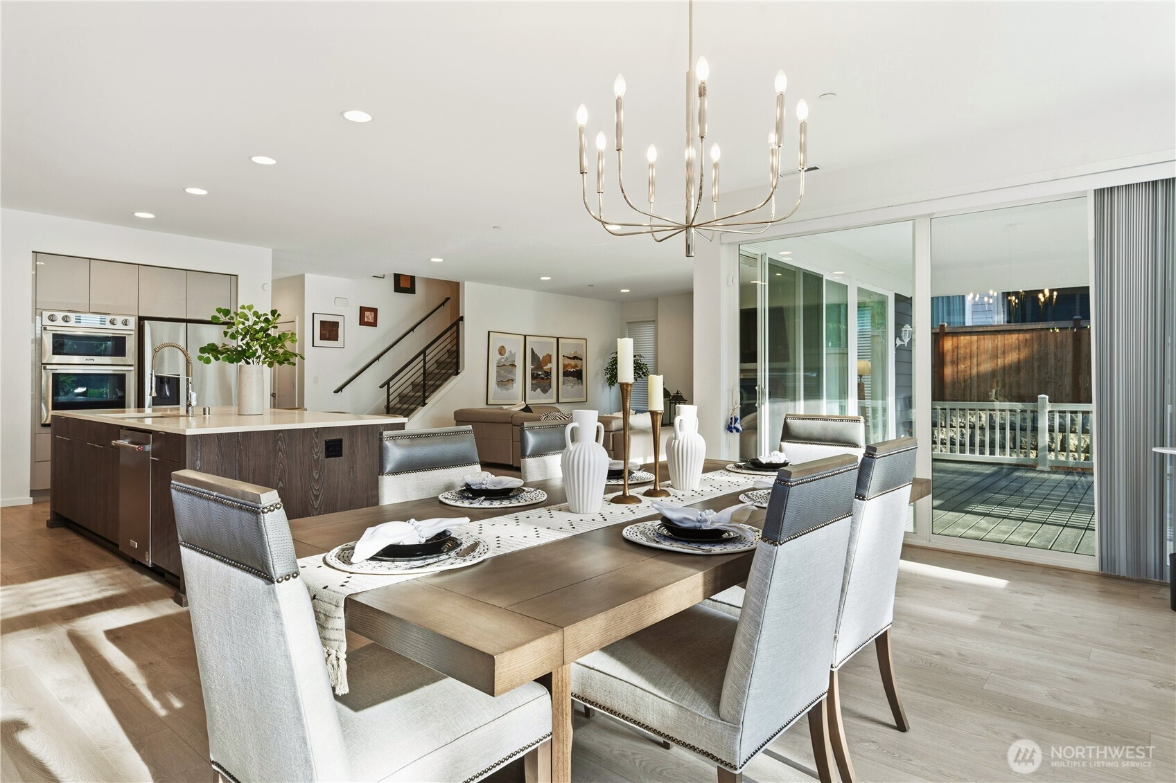 6563 Southeast 8th Street Renton, WA 98059 - Photo 18 of 40 a view of a dining room with furniture wooden floor and chandelier