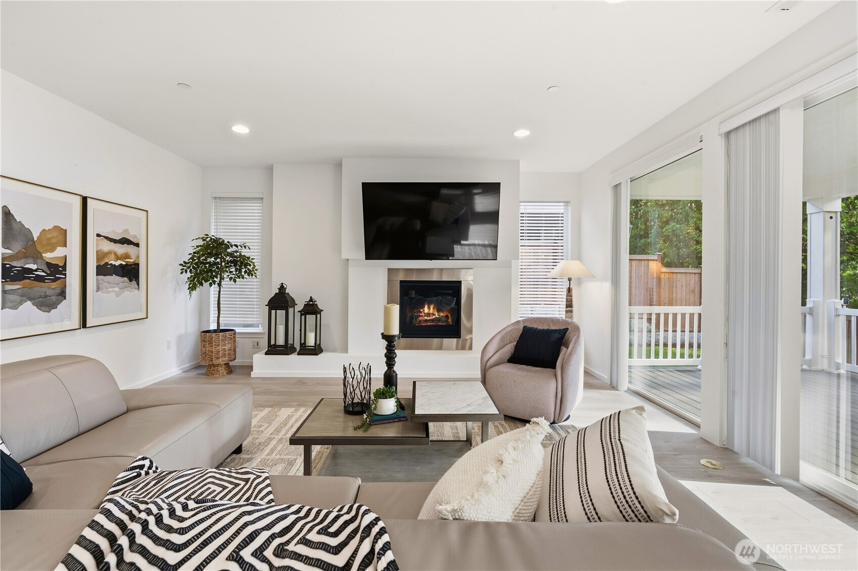 6563 Southeast 8th Street Renton, WA 98059 - Photo 19 of 40 a living room with furniture fireplace and a flat screen tv