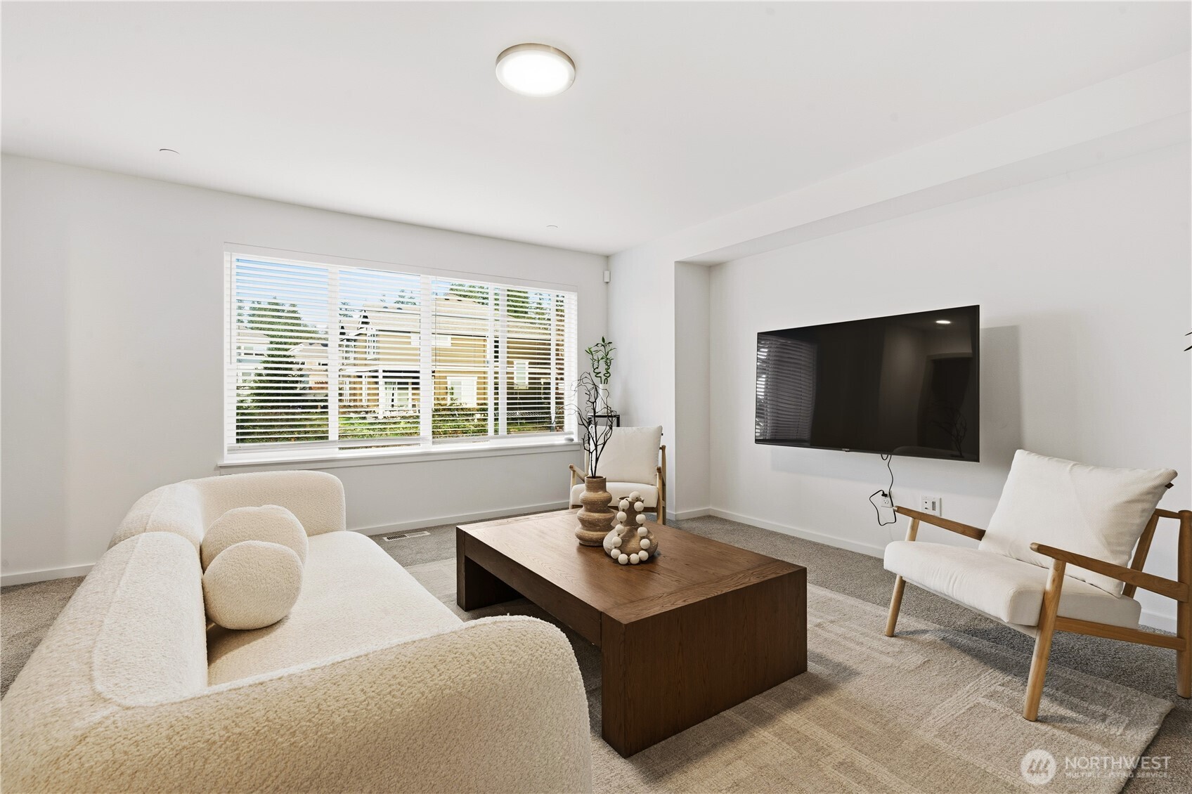 6563 Southeast 8th Street Renton, WA 98059 - Photo 22 of 40 a living room with furniture and a flat screen tv