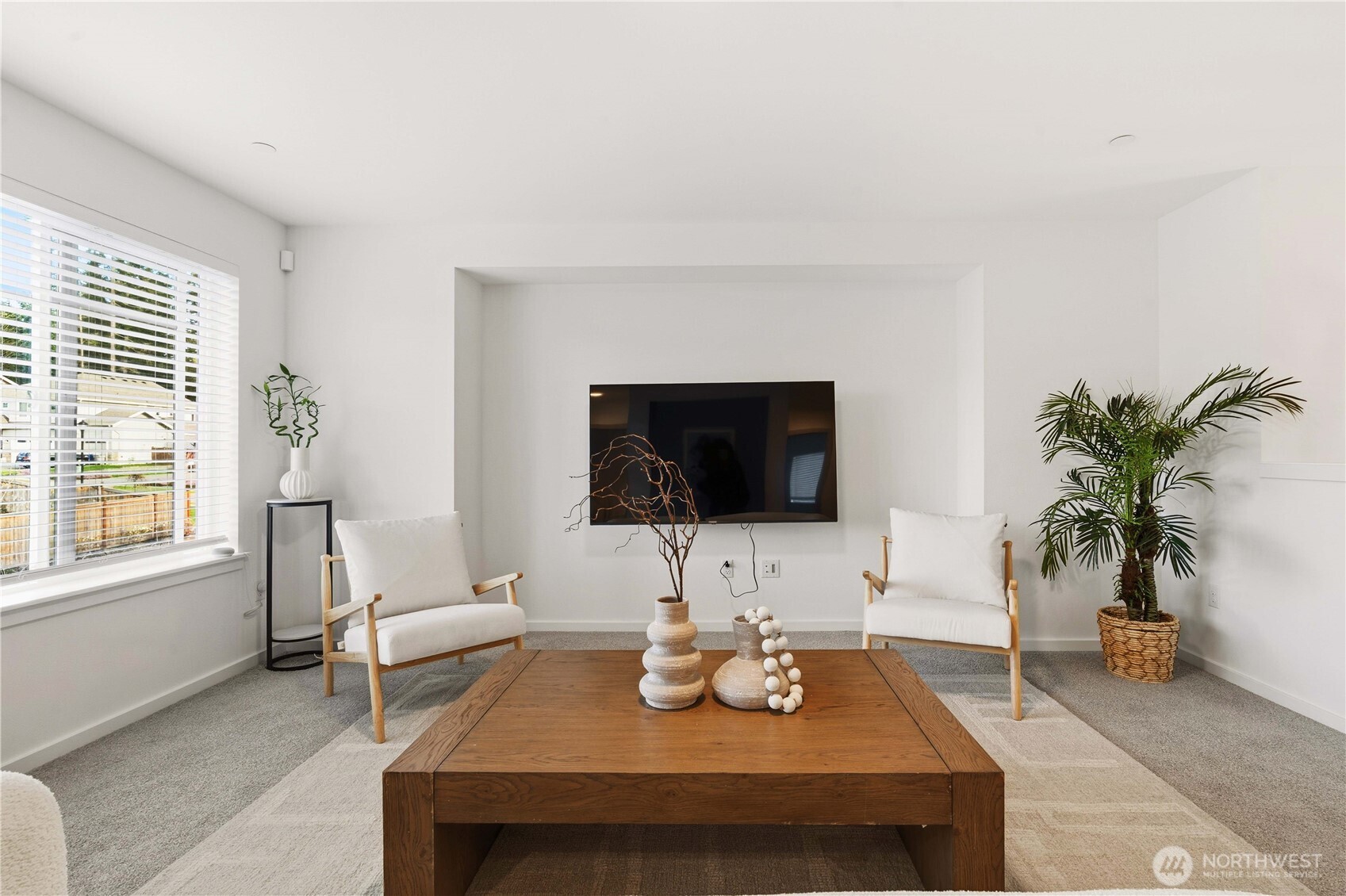 6563 Southeast 8th Street Renton, WA 98059 - Photo 23 of 40 a living room with furniture and a flat screen tv